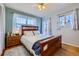 Comfortable main bedroom with serene decor, natural light, and hardwood floors at 347 Buena Vista Ave, Palmer Lake, CO 80133