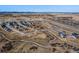 Aerial view of the residential neighborhood and surrounding landscape, showcasing its location near roads and open fields at 16529 Black Rose Cir, Parker, CO 80134