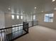 Cozy loft area overlooking the living room with wrought iron railings and ample natural light at 16529 Black Rose Cir, Parker, CO 80134