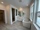 Spa-like bathroom with double vanity, modern soaking tub, and glass-enclosed shower at 16529 Black Rose Cir, Parker, CO 80134