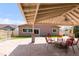 Covered patio with backyard entertaining space and fire pit at 1249 S Irving St, Denver, CO 80219