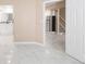 Open basement with tile flooring, mini-kitchen, and access to bathroom and stairs at 1249 S Irving St, Denver, CO 80219