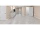 Large open basement area featuring modern floors and potential for a wet bar at 1249 S Irving St, Denver, CO 80219