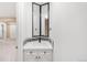 A charming bathroom vanity with tiled backsplash and modern fixtures at 1249 S Irving St, Denver, CO 80219