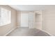 Bedroom with carpet, closet and view into hallway at 1249 S Irving St, Denver, CO 80219