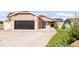 Charming single-Gathering home featuring a two-car garage, brick accents, and a well-maintained lawn at 1249 S Irving St, Denver, CO 80219