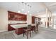 Open kitchen with granite countertops, wine rack, and bar seating at 1249 S Irving St, Denver, CO 80219