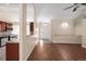 Spacious living room with hardwood floors offering views into the kitchen and entryway at 1249 S Irving St, Denver, CO 80219