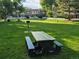 Green common area featuring picnic tables and barbecue grills for residents enjoyment at 850 W Moorhead Cir # 3F, Boulder, CO 80305