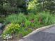 Landscaped yard featuring colorful flowers and a variety of lush plants and greenery at 850 W Moorhead Cir # 3F, Boulder, CO 80305