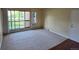 Inviting living room with neutral carpeting and a large window providing natural light at 850 W Moorhead Cir # 3F, Boulder, CO 80305