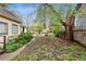 Large backyard featuring mature trees and ample space for gardening or recreation at 4151 Zenobia St, Denver, CO 80212