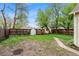 Expansive backyard with a fence and a pathway, offering privacy and space at 4151 Zenobia St, Denver, CO 80212