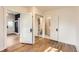 Bedroom boasts gleaming hardwood floors and multiple access points to other rooms at 4151 Zenobia St, Denver, CO 80212