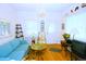 Bright living room with hardwood floors, neutral walls and chandelier at 4151 Zenobia St, Denver, CO 80212