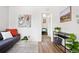 Bright living room with hardwood floors, contemporary decor, and comfortable seating at 4151 Zenobia St, Denver, CO 80212