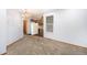 Bright dining area with updated lighting, neutral carpet, and a view into the kitchen, perfect for entertaining at 922 S Dearborn Way # 8, Aurora, CO 80012