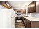 Efficient kitchen showcasing wood-look flooring, modern appliances, and ample counter space for meal preparation at 922 S Dearborn Way # 8, Aurora, CO 80012