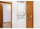 Convenient in-unit laundry area featuring a stacked washer and dryer, maximizing space and efficiency at 922 S Dearborn Way # 8, Aurora, CO 80012
