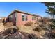 Backyard features a pathway and small bridge at 851 Lonewolf Cir, Lochbuie, CO 80603