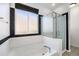 Bathroom boasts a shower and bathtub at 851 Lonewolf Cir, Lochbuie, CO 80603