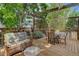 Outdoor living on the back deck with natural wood, seating and pergola at 17605 Ponderosa Ave, Parker, CO 80134