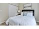 Inviting bedroom with plush bedding, closet, and neutral color scheme at 17605 Ponderosa Ave, Parker, CO 80134