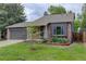 Charming single-Gathering home with a well-manicured lawn, brick accents and an attached garage at 17605 Ponderosa Ave, Parker, CO 80134