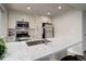 Modern kitchen features stainless appliances, light counters, and updated cabinets at 17605 Ponderosa Ave, Parker, CO 80134