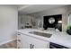Well-lit kitchen with modern countertops, cabinets, and kitchen sink at 17605 Ponderosa Ave, Parker, CO 80134