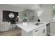 Open kitchen features modern countertops and is open to the living area at 17605 Ponderosa Ave, Parker, CO 80134