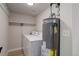 Utility room features a washer, dryer, and water heater at 17605 Ponderosa Ave, Parker, CO 80134