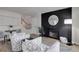 Bright room with wood-look flooring and decor elements, statement fireplace wall, and staircase at 17605 Ponderosa Ave, Parker, CO 80134