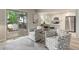 Cozy living room with slider to patio, showcasing modern kitchen, offering an open concept layout at 17605 Ponderosa Ave, Parker, CO 80134