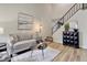 Bright living room with neutral colors, high ceilings, sleek floors, and modern decor elements at 17605 Ponderosa Ave, Parker, CO 80134