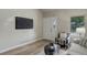 Neutral living area features sleek floors, ample natural light, and minimal decor at 17605 Ponderosa Ave, Parker, CO 80134