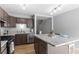 Updated kitchen featuring stainless steel appliances, an island, and wood floors at 8979 Field St # 27, Westminster, CO 80021