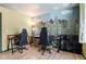 Home office area features custom nature mural, a window view and office desks at 8979 Field St # 27, Westminster, CO 80021