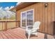 Inviting back deck featuring wood flooring and a comfortable chair, ideal for outdoor relaxation at 811 Panorama Dr, Elizabeth, CO 80107