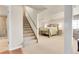 Spacious basement bedroom with staircase access and adjacent bathroom enhances lower-level living at 811 Panorama Dr, Elizabeth, CO 80107