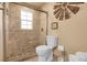 Bathroom with tiled shower and glass door, offering a clean and modern aesthetic at 811 Panorama Dr, Elizabeth, CO 80107