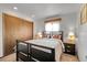 Comfortable bedroom with a dark wood frame bed and matching nightstands at 811 Panorama Dr, Elizabeth, CO 80107