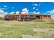 Spacious, ranch-style home with two-tiered decks and a large yard, perfect for outdoor living and entertaining at 811 Panorama Dr, Elizabeth, CO 80107