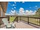 Inviting deck area with stunning views of the expansive green fields and blue sky at 811 Panorama Dr, Elizabeth, CO 80107