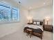 Bright bedroom with large window, neutral decor, and comfortable furnishings at 805 Promenade Dr, Superior, CO 80027