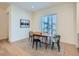 Inviting dining room featuring a wooden table, black chairs, and a large window at 805 Promenade Dr, Superior, CO 80027