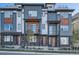 Contemporary townhome exteriors with mixed materials, private balconies, and well-manicured landscaping at 805 Promenade Dr, Superior, CO 80027