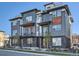 Modern townhomes feature balconies, stone accents, and well-manicured landscaping at 805 Promenade Dr, Superior, CO 80027