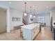Open-concept kitchen with a large island, modern lighting, and seamless flow to the living areas at 805 Promenade Dr, Superior, CO 80027