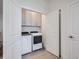 Functional laundry room with modern washer and dryer, cabinet storage, and easy access at 805 Promenade Dr, Superior, CO 80027